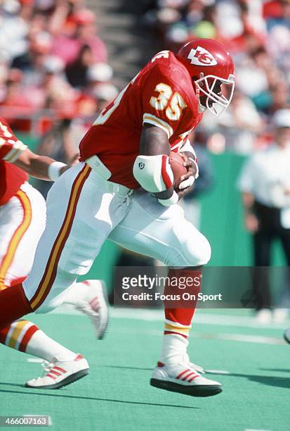 Christian Okoye of the Kansas City Chiefs carries the ball against the Detroit Lions during an NFL football game October 14, 1990 at Arrowhead...