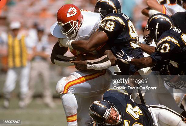 Christian Okoye of the Kansas City Chiefs gets tackled by Lee Williams of the San Diego Chargers during an NFL football game September 24, 1989 at...