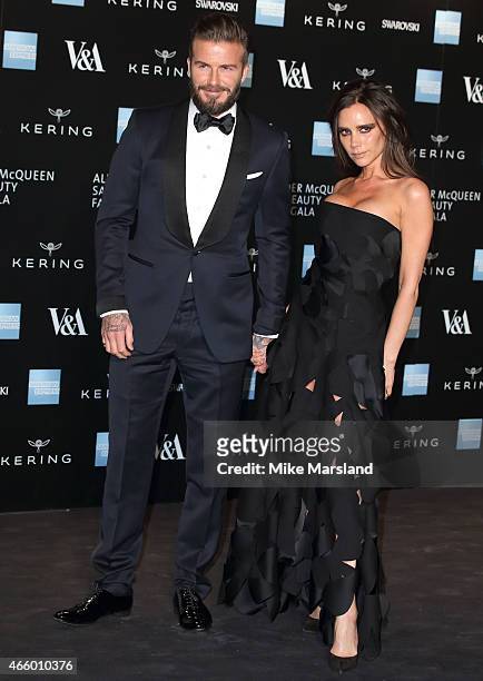 Victoria Beckham and David Beckham attend a private view for the "Alexander McQueen: Savage Beauty" exhibition at Victoria & Albert Museum on March...