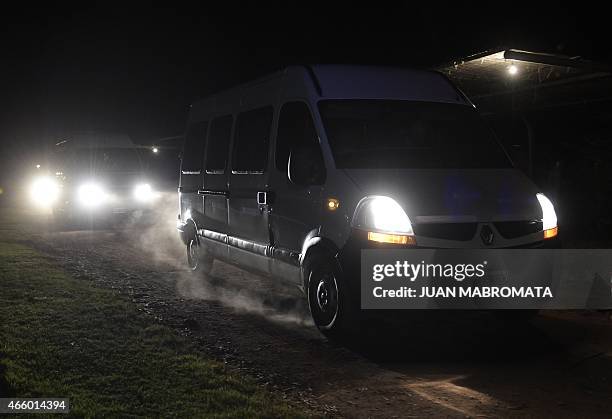 Van transporting French former Olympic athletes and members of a reality TV show is escorted by a vehicle of the National Gendarmerie as they depart...