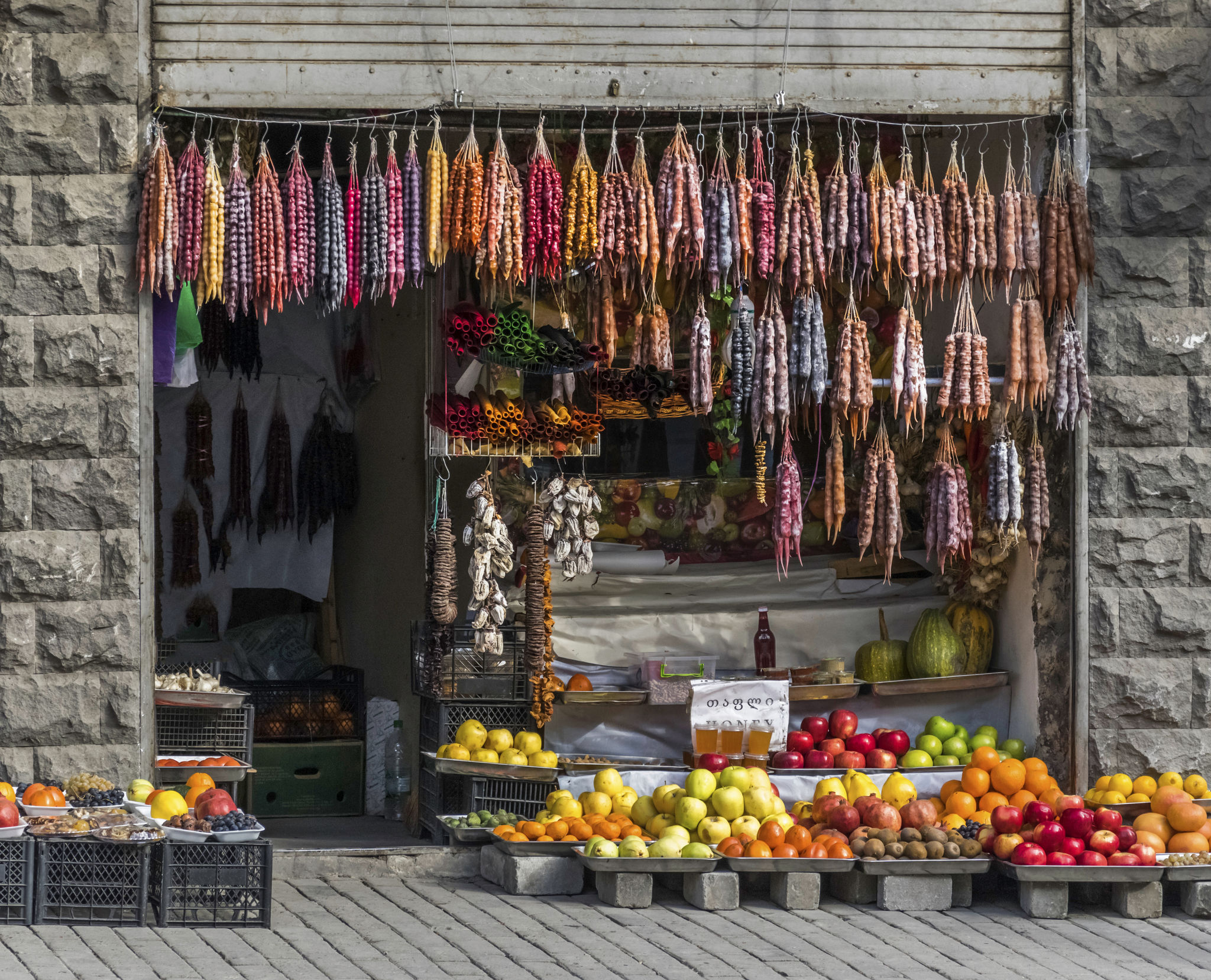 produce market store front , churchkhela, colorful fruit - Tbilisi Georgia produce market store front , churchkhela, colorful fruit - Tbilisi Georgia