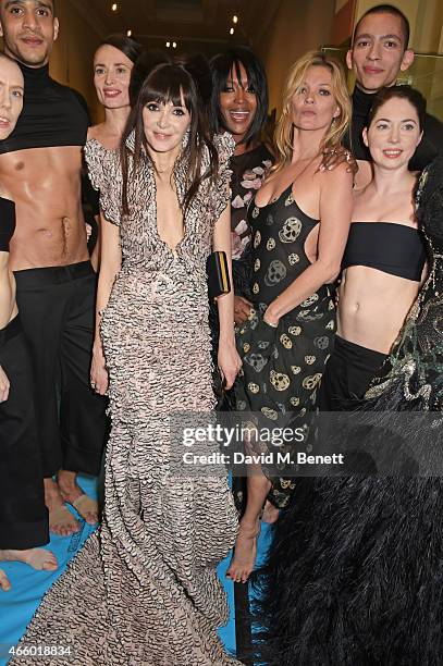 Annabelle Neilson, Naomi Campbell and Kate Moss pose with dancers from the Michael Clarke dance troupe backstage at the Alexander McQueen: Savage...