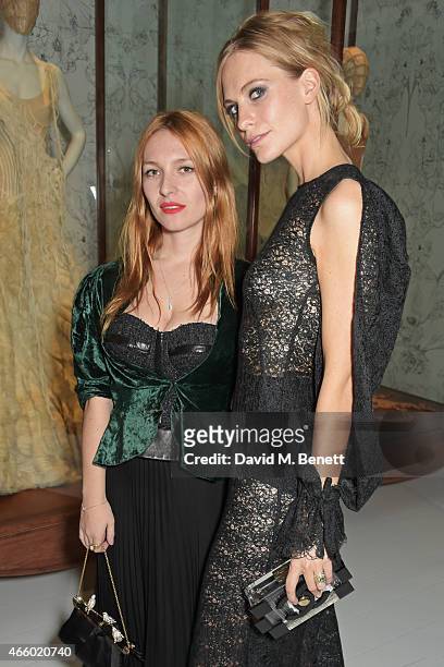 Josephine de la Baume and Poppy Delevingne attend the Alexander McQueen: Savage Beauty Fashion Gala at the V&A, presented by American Express and...