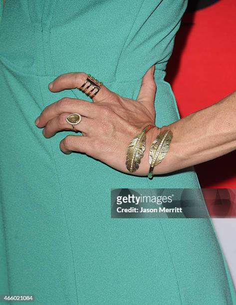 Actress Perrey Reeves, jewelry detail, attends the premiere of Open Road Films' "The Gunman" at Regal Cinemas L.A. Live on March 12, 2015 in Los...