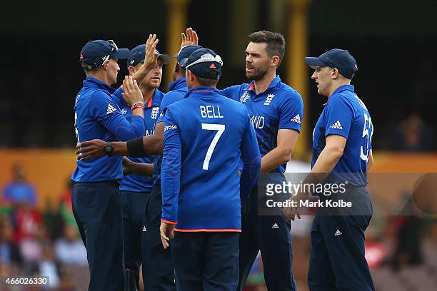 James Anderson of England celebrates with his team mates after taking the wicket of Mohammad Nabi of Afghanistan during the 2015 Cricket World Cup...