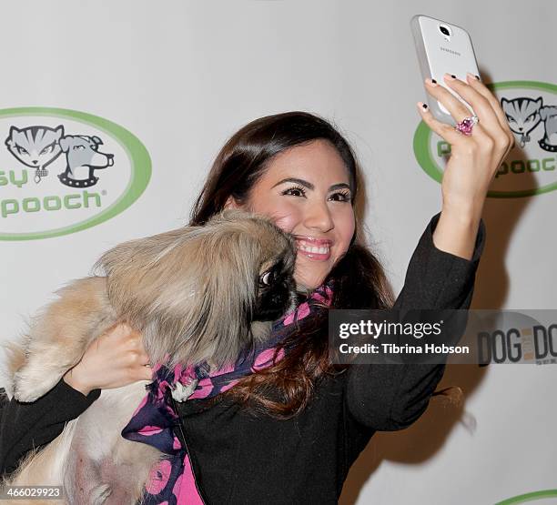 Adriana Michelle takes a selfie at the 'A Fur Affair' to benefit animal welfare superheroes at Pussy & Pooch Pet Lifestyle Center on January 30, 2014...