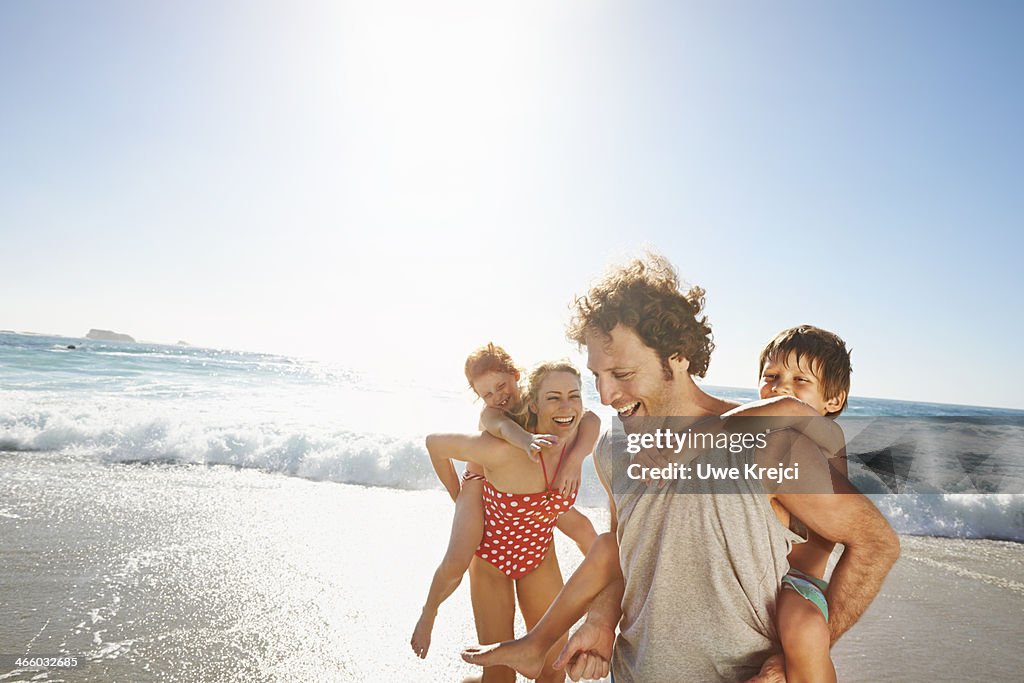 Family playing at the beach