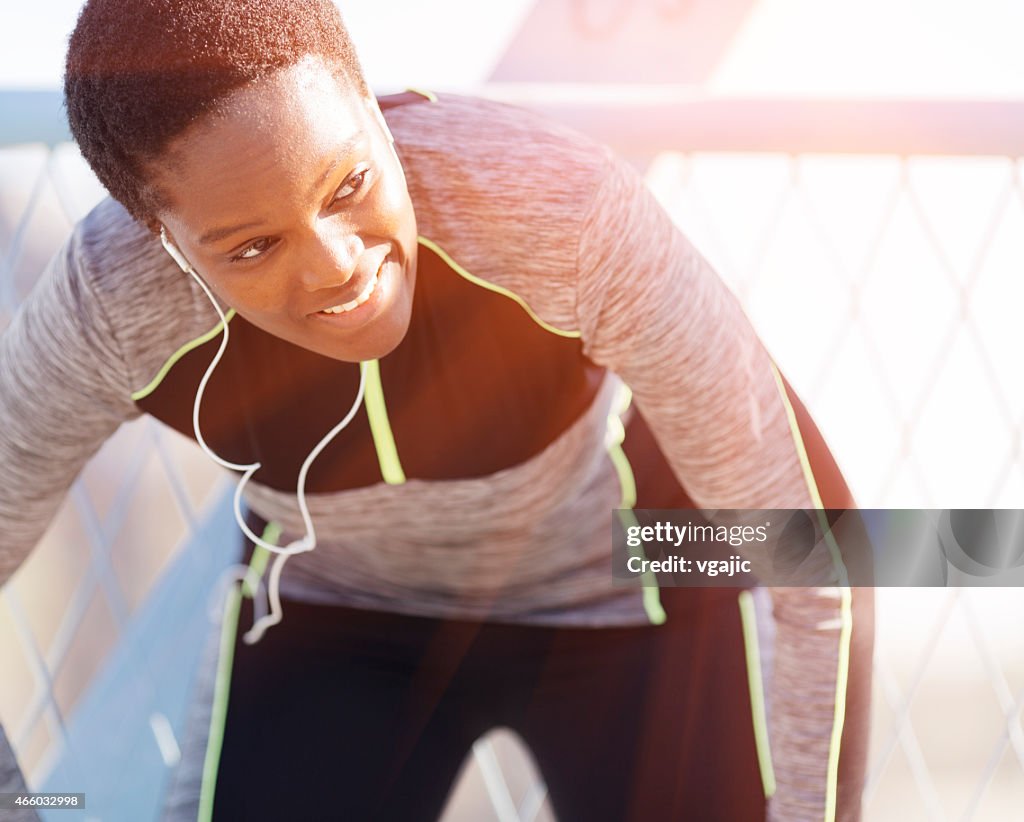 African Woman break after jogging.