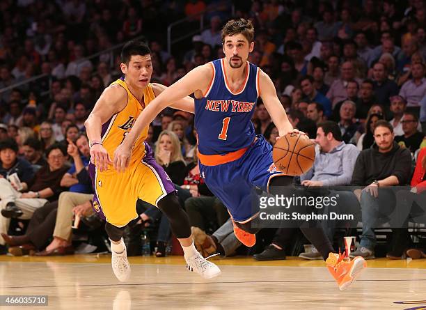 Alexey Shved of the New York Knicks drives past Jeremy Lin of the Los Angeles Lakers at Staples Center on March 12, 2015 in Los Angeles, California....