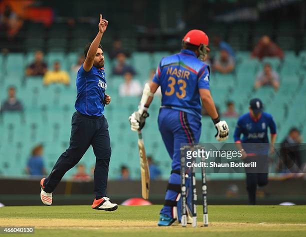 Ravi Bopara of England celebrates after taking the wicket of Nasir Jamal of Afghanistan during the 2015 Cricket World Cup match between England and...