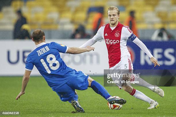 Roman Zozulya of FC Dnipro Dnipropetrovsk, Nicolai Boilesen of Ajax during the Europa League round of 16 match between FC Dnipro Dnipropetrovsk and...