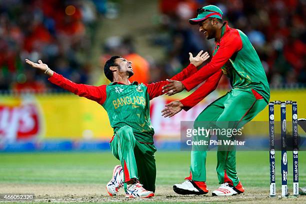 Nasir Hossain of Bangladesh celebrates his wicket of Ross Taylor of New Zealand with Shakib Al Hasan during the 2015 ICC Cricket World Cup match...