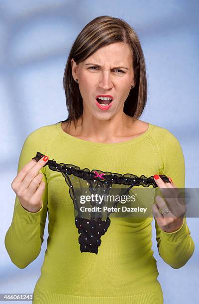 angry wife with knickers - string stockfoto's en -beelden