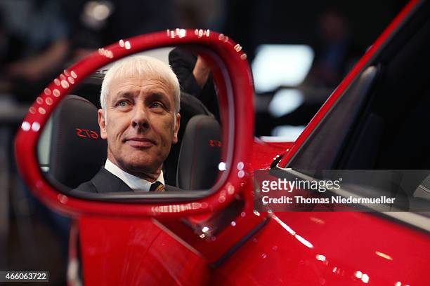 Matthias Mueller, CEO of Porsche AG poses in a Porsche Targa 4 GTS at the Porsche AG annual press conference on March 13, 2015 in Stuttgart, Germany....
