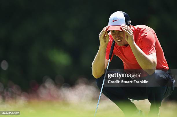 Ross Fisher of England lines up a putt during the second round of the Tshwane Open at Pretoria Country Club on March 13, 2015 in Pretoria, South...