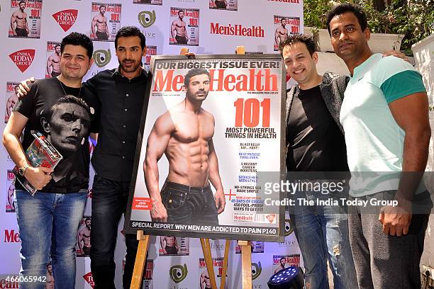 John Abraham with editor of Mens Health magazine Jamal Shaikh and Dabboo Ratnani at the cover launch of Mens Health magazine featuring John Abraham...