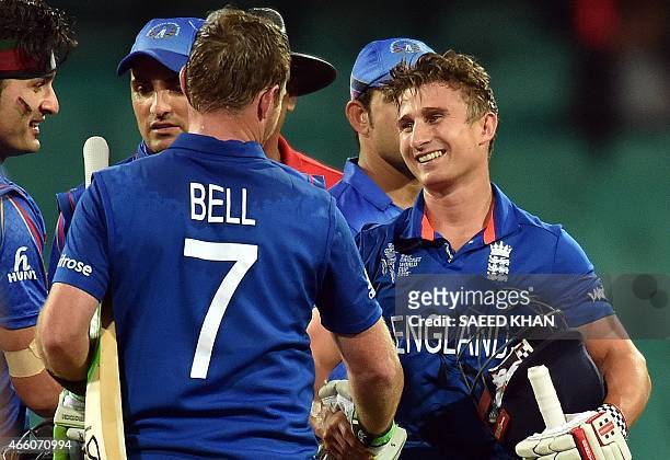 England's batsmen James Taylor and Ian Bell celebrate their victory over Afghanistan during the 2015 Cricket World Cup Pool A match between England...