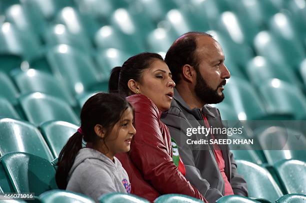 Afghan fans watch the England's winning run against Afghanistan during the 2015 Cricket World Cup Pool A match between England and Afghanistan at the...