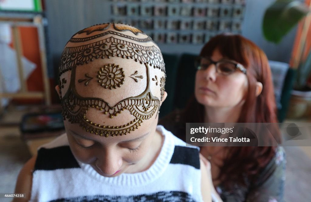 Artist Tarquin Singh Applying Henna To Madeline Urbina