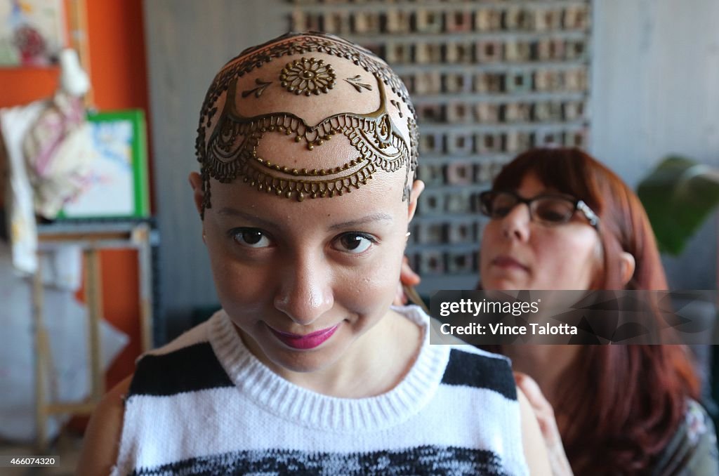 Artist Tarquin Singh Applying Henna To Madeline Urbina