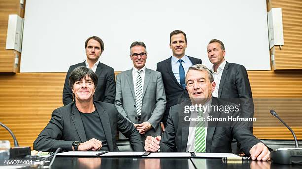 Joachim Loew, head coach of the German national football team , and DFB President Wolfgang Niersbach pose with Thomas Schneider, Helmut Sandrock,...