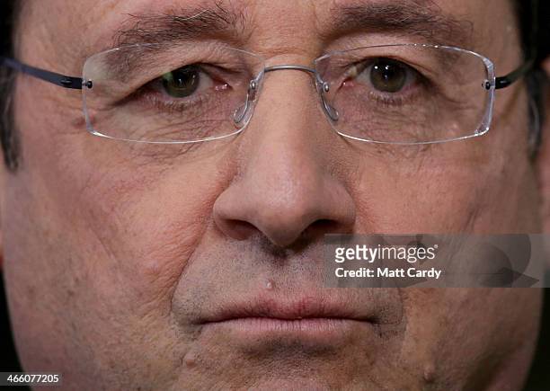 French President Francois Hollande takes part in a press conference during the joint summit at RAF Brize Norton on January 31, 2014 in Brize Norton,...