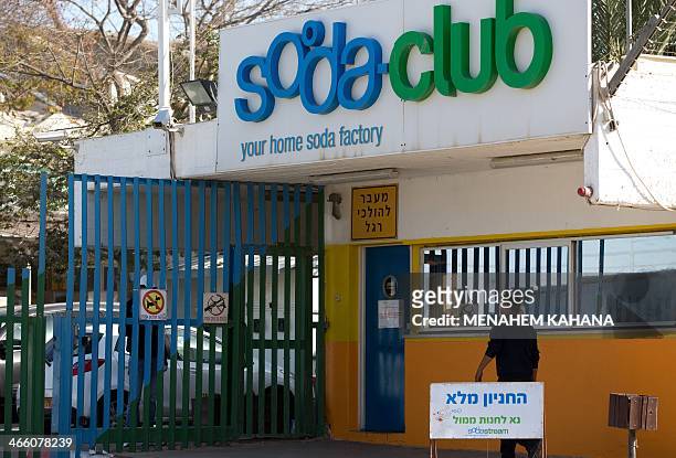 Worker arrives at the Israeli SodaStream factory on January 30, 2014 in the Mishor Adumim industrial park, next to the West Bank settlement of Maale...