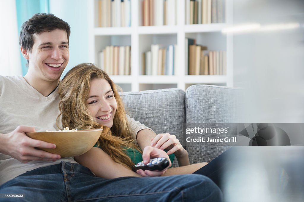 Couple watching TV together