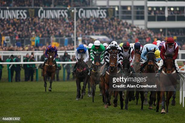 General view as runners turn away from the grandstands during Gold Cup day at the Cheltenham Festival at Cheltenham racecourse on March 13, 2015 in...