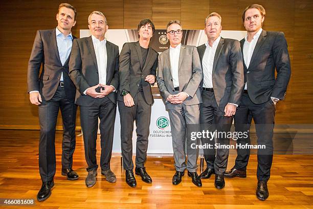 Oliver Bierhoff, Wolfgang Niersbach, Joachim Loew, Helmut Sandrock, Andreas Koepke and Thomas Schneider pose during a press conference to announce...