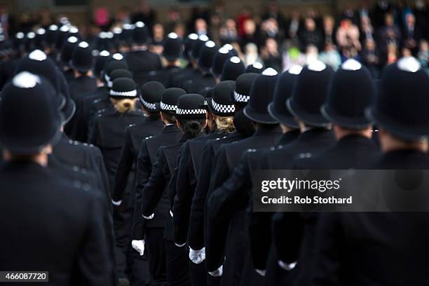 New recruits to the Metropolitan Police Service take part in their 'Passing Out Parade' at Hendon Training Centre on March 13, 2015 in London,...