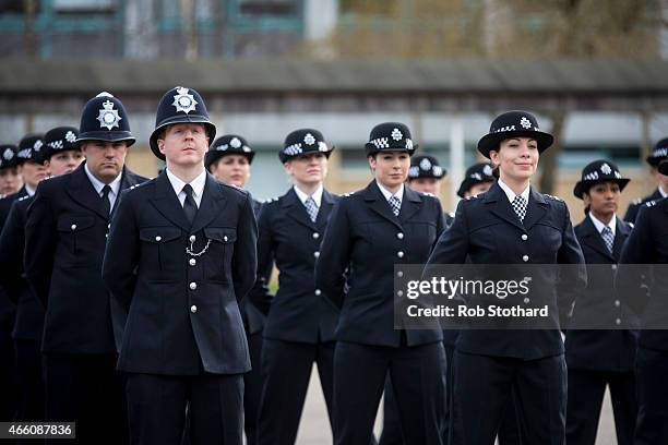 New recruits to the Metropolitan Police Service take part in their 'Passing Out Parade' at Hendon Training Centre on March 13, 2015 in London,...