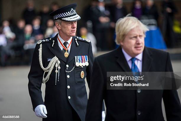 Metropolitan Police Commissioner Sir Bernard Hogan-Howe and Mayor of London Boris Johnson attend the 'Passing Out Parade' for new recruits to the...