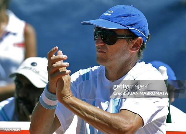 Argentina's tennis captain Martin Jaite gestures during the Davis Cup World Group 1st Round single tennis match between Italy's tennis player Andreas...