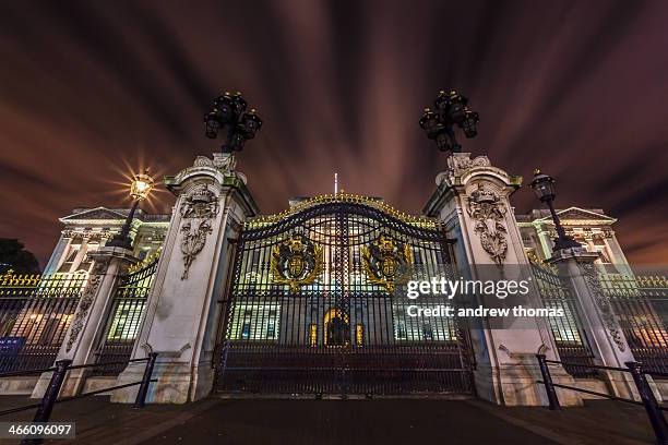 Taken at night a long exposure in front of the gates at Buckingham palace in London in a low down position as if too replicate meeting the queen and...