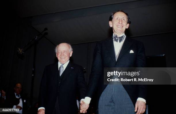 Hungarian-born American conductor Eugene Ormandy and Russian-born American pianist Vladimir Horowitz smile from the stage at Carnegie Hall, January...