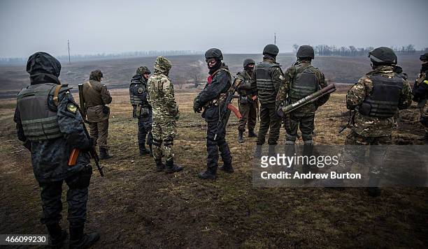 Ukrainian troops from Donbass battalion train with small arms on March 13, 2015 outside Mariupol, Ukraine. The Minsk ll ceasefire agreement, which...