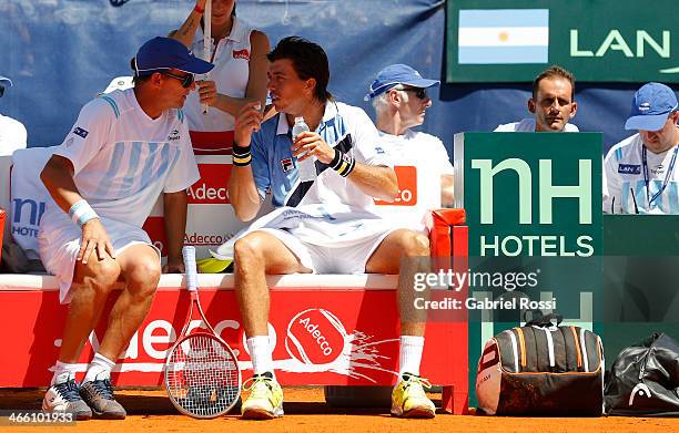 Argentinian coach Martin Jaite talks to Carlos Berlocq during a match between Argentina and Italy as part of the Davis Cup at Patinodromo Stadium on...