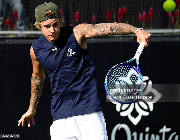 Singer Justin Bieber plays tennis at the 11th Annual Desert Smash Hosted By Will Ferrell Benefiting Cancer For College at La Quinta Resort and Club...