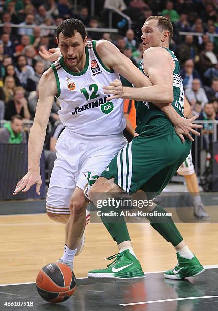 Loukas Mavrokefalides, #12 of Panathinaikos Athens competes with Darius Songaila, #9 of Zalgiris Kaunas in action during the Turkish Airlines...