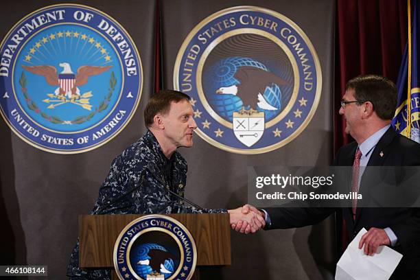 Navy Admiral Michael Rogers , commander of the U.S. Cyber Command and director of the National Security Agency, welcomes Secretary of Defense Ash...