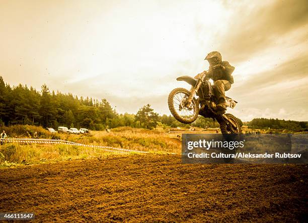 boy mid air on motorcycle at motocross - motocross imagens e fotografias de stock