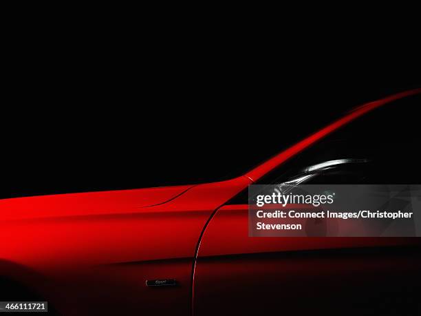 red sports car - brand name sports car stockfoto's en -beelden