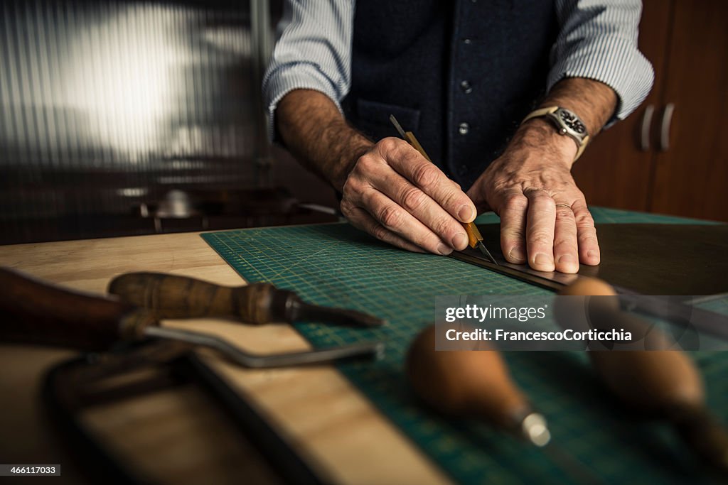 Artisan working with leather in a workshop
