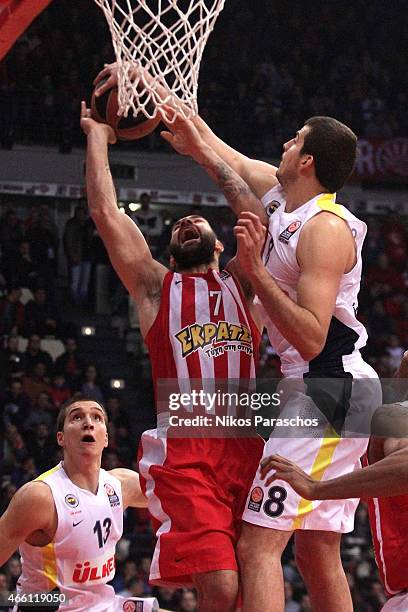 Vassilis Spanoulis, #7 of Olympiacos Piraeus competes with Nemanja Bjelica, #8 of Fenerbahce Ulker Istanbu during the Turkish Airlines Euroleague...