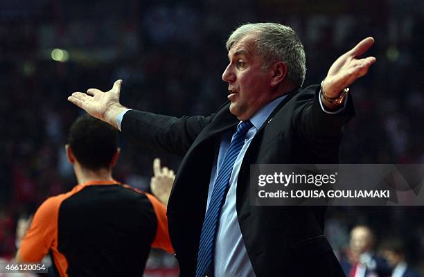 Fenerbahce coach Zeliko Obradovic reacts during their Euroleague basketball Top 16 match at the Peace and Friendship stadium in Piraeus district of...