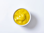 A bowl of smooth Dijon mustard