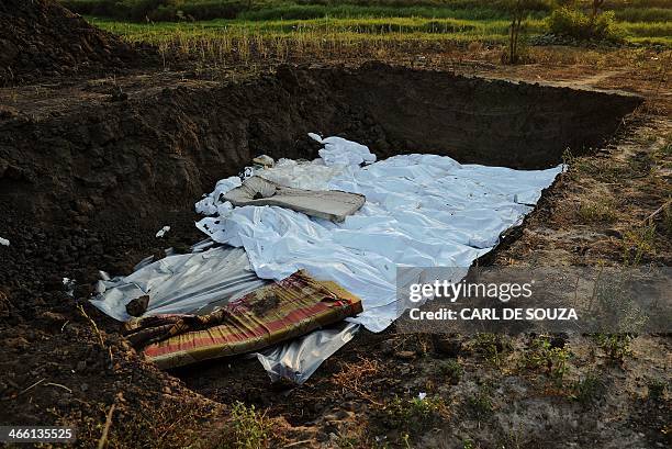 View of a mass grave near St Andrews church in Bor on January 31, 2014. Recent fighting in the country has seen waves of brutal revenge attacks, as...