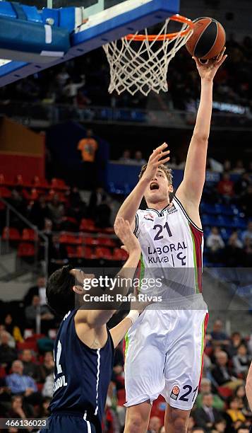 Tibor Pleiss, #21 of Laboral Kutxa Vitoria competes with Kerem Gonlum, #12 of Anadolu Efes Istanbul during the 2013-2014 Turkish Airlines Euroleague...