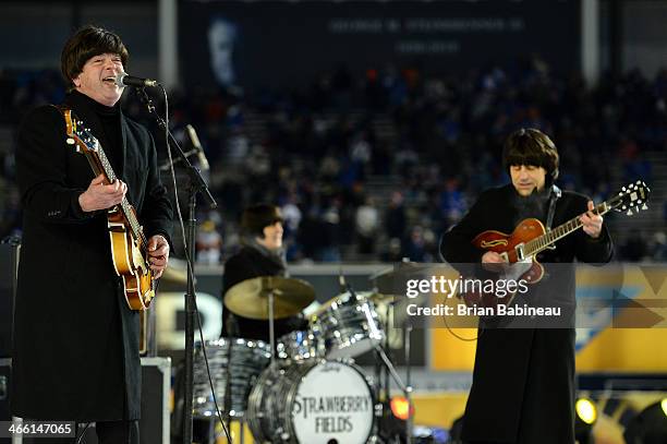 Billy J. Ray and John Korba of Strawberry Fields performs during the 2014 Coors Light NHL Stadium Series at Yankee Stadium on January 29, 2014 in the...